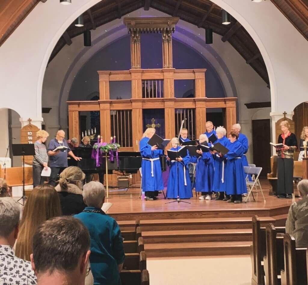 Blue robed choir singing in main sanctuary