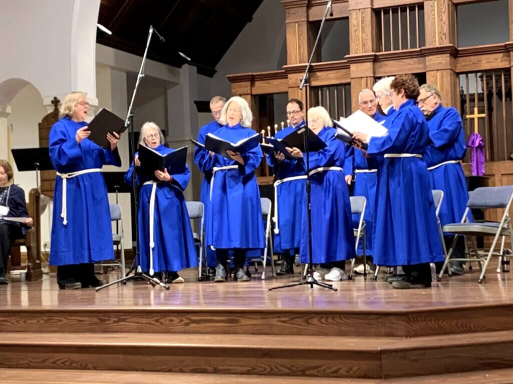 Blue robed choir singing in main sanctuary