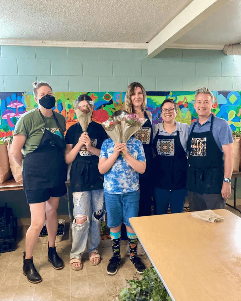 Several generations of parishioners gather to serve at First Nations Kitchen food pantry in summer 2024